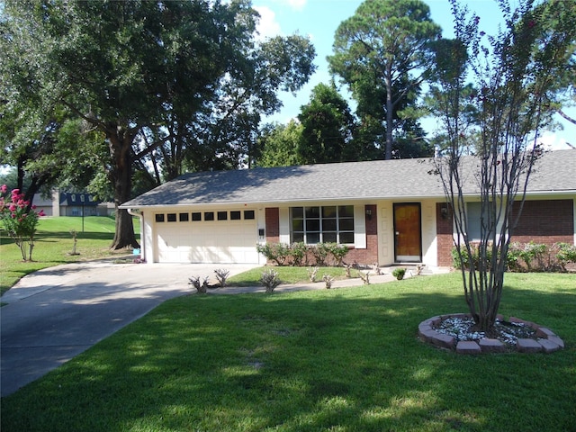 ranch-style house featuring a front yard and a garage