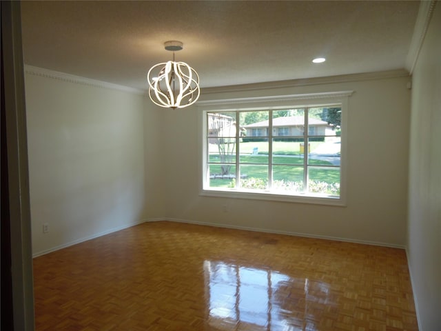 empty room with a notable chandelier, parquet floors, and ornamental molding