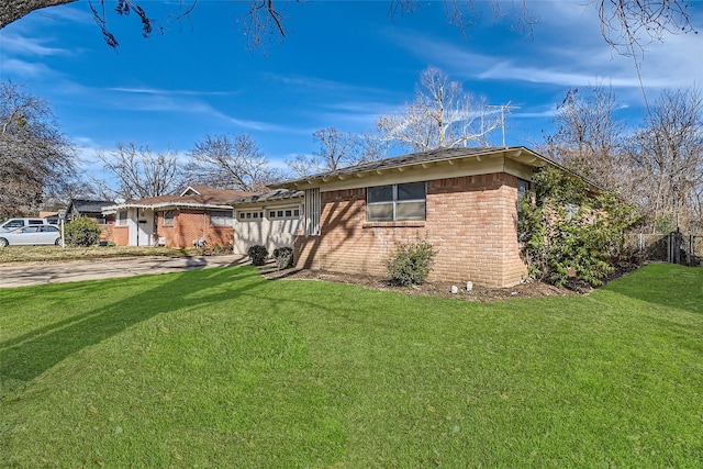 single story home with a garage and a front yard