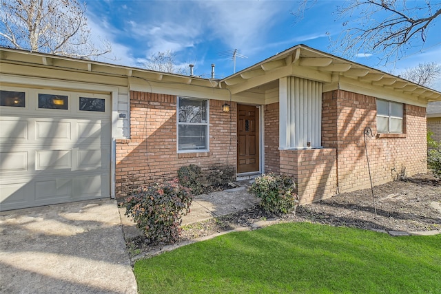 doorway to property with a garage