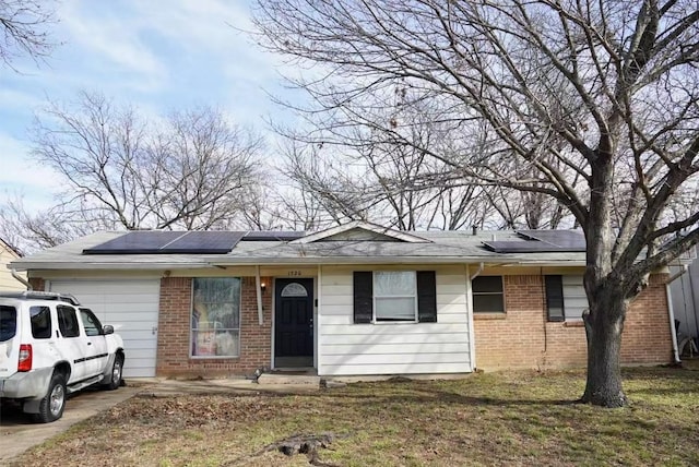 single story home featuring solar panels