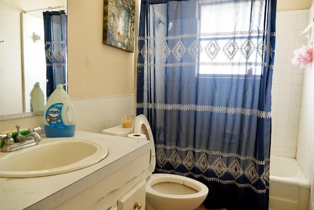 full bathroom featuring toilet, vanity, and shower / bathtub combination with curtain