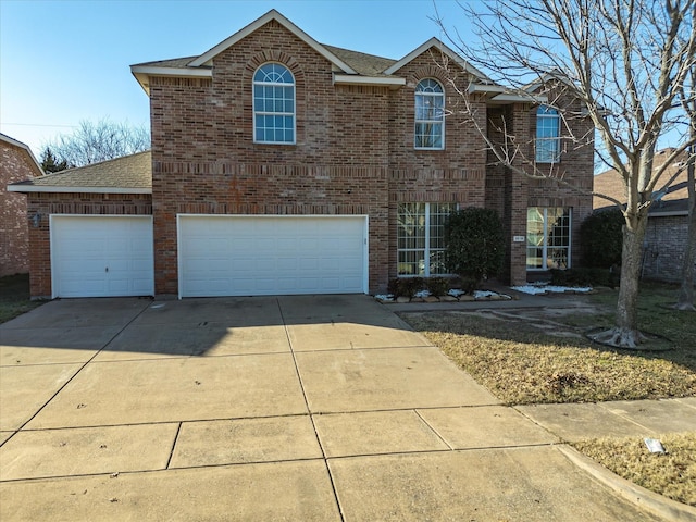 view of front of property with a garage