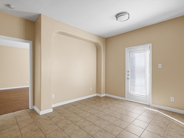 empty room with light tile patterned floors