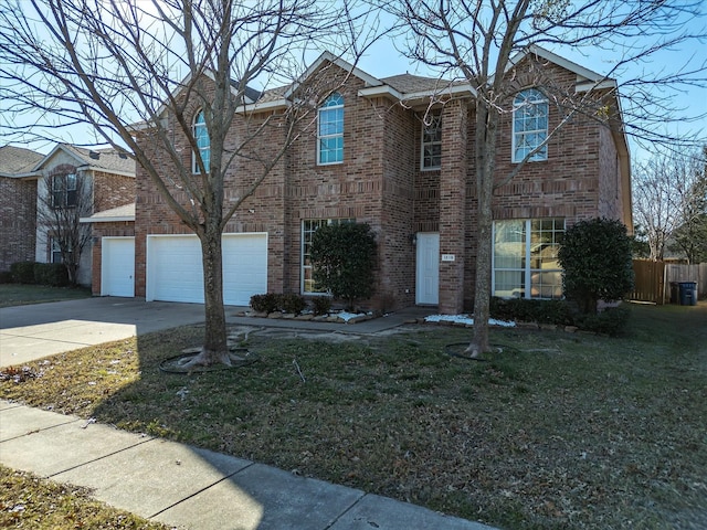 view of front of home featuring a front yard and a garage