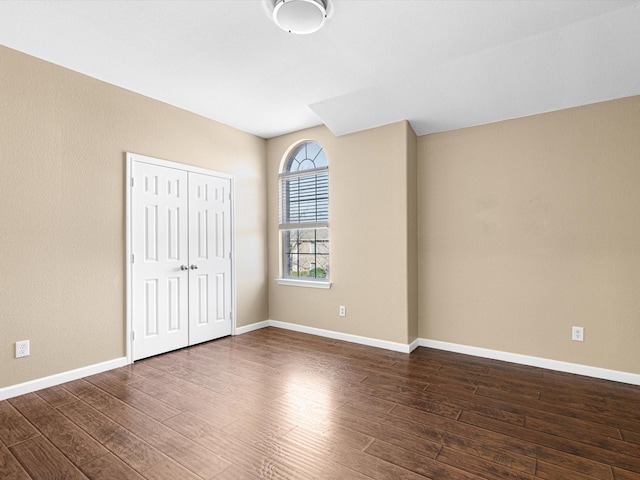 unfurnished room featuring dark hardwood / wood-style floors