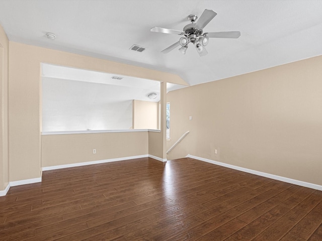 spare room with dark wood-type flooring and ceiling fan