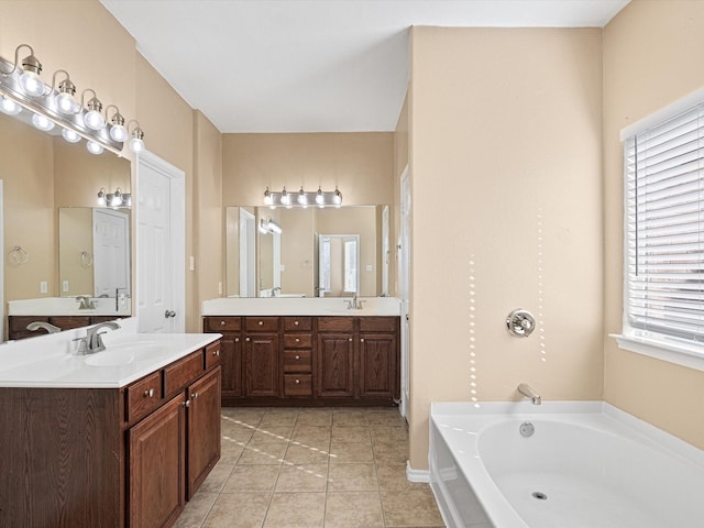 bathroom featuring a bathtub, tile patterned floors, and vanity