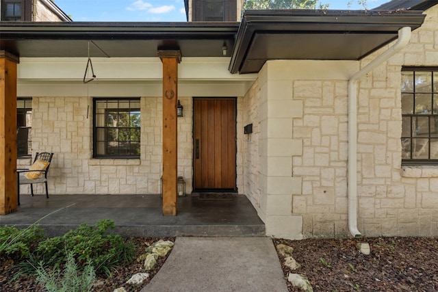 doorway to property featuring a porch