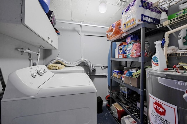 laundry room featuring cabinets and washing machine and clothes dryer