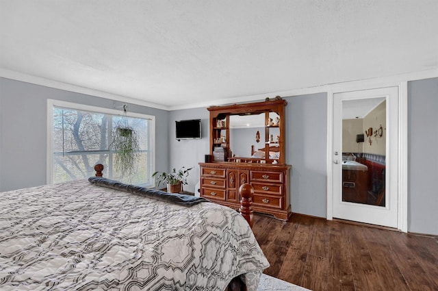 bedroom with dark hardwood / wood-style floors and ornamental molding