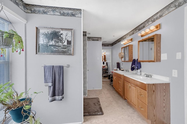 bathroom featuring tile patterned flooring and vanity