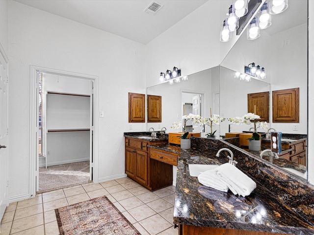 bathroom with tile patterned floors and vanity