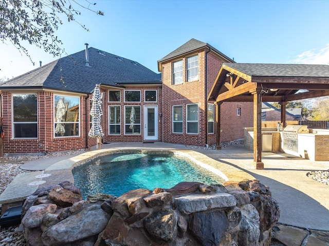 view of pool featuring a patio area and area for grilling