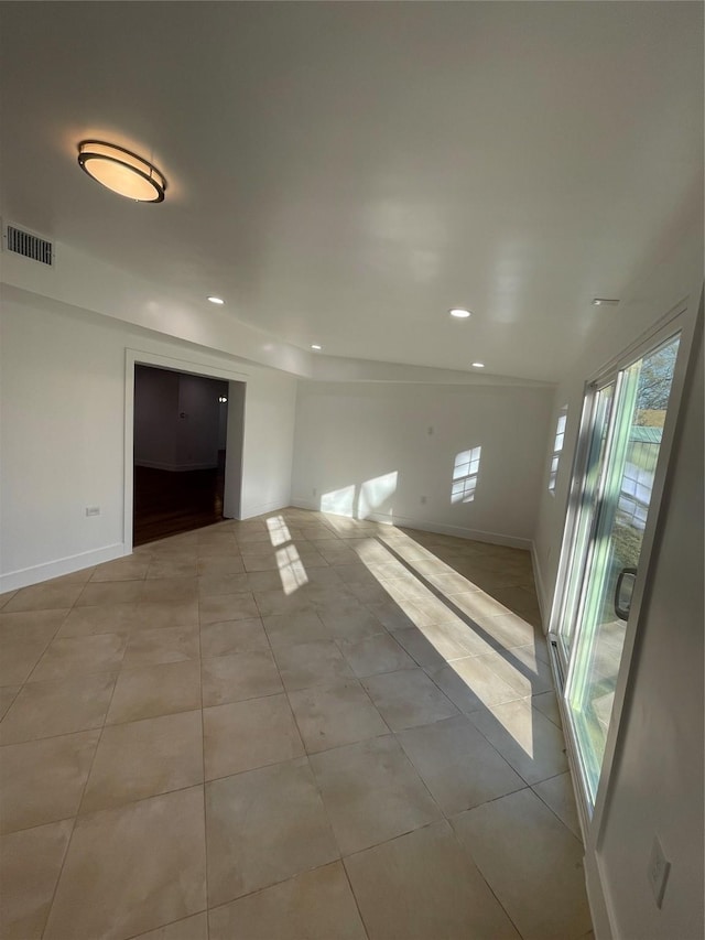 unfurnished room featuring light tile patterned floors