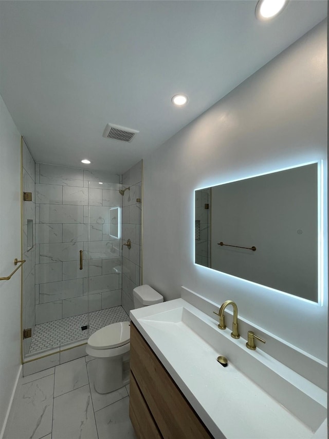 bathroom with a shower with shower door, toilet, and vanity