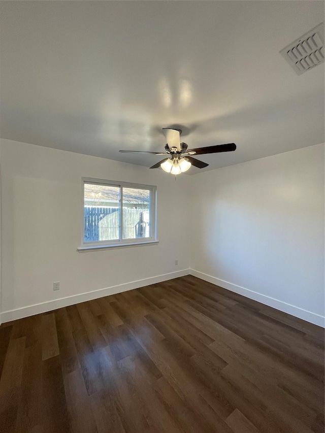 unfurnished room featuring ceiling fan and dark hardwood / wood-style floors