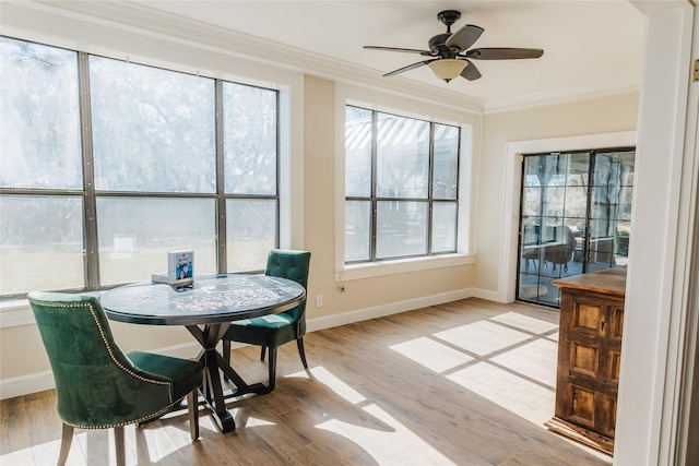 sunroom / solarium with ceiling fan and a healthy amount of sunlight