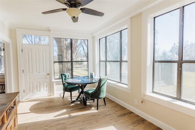 sunroom / solarium with ceiling fan