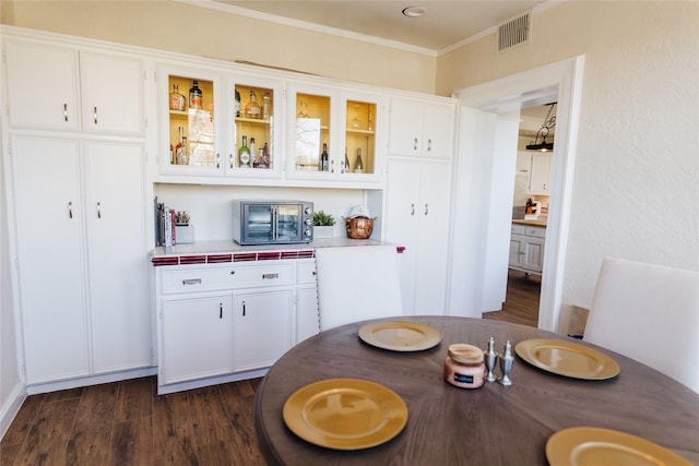 dining room featuring dark wood-type flooring