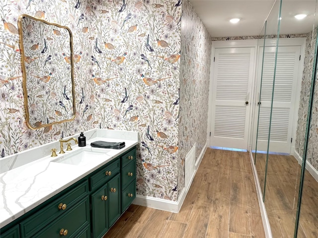 bathroom with vanity and wood-type flooring