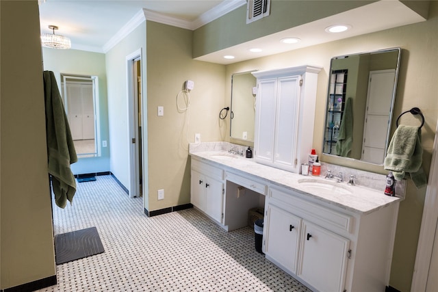 bathroom with vanity and crown molding