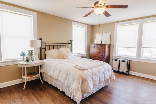 bedroom featuring ceiling fan and dark wood-type flooring