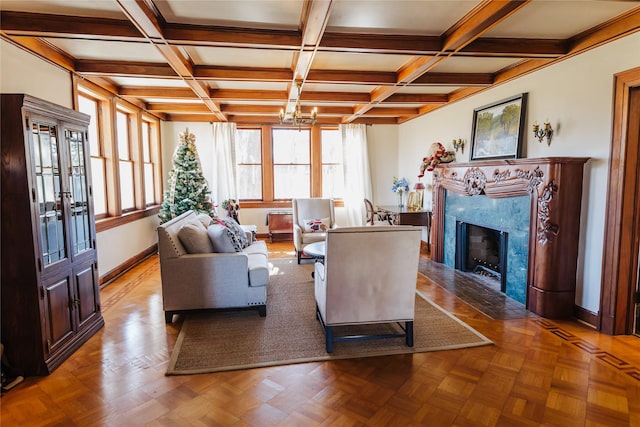 living room with light parquet floors, a high end fireplace, and coffered ceiling