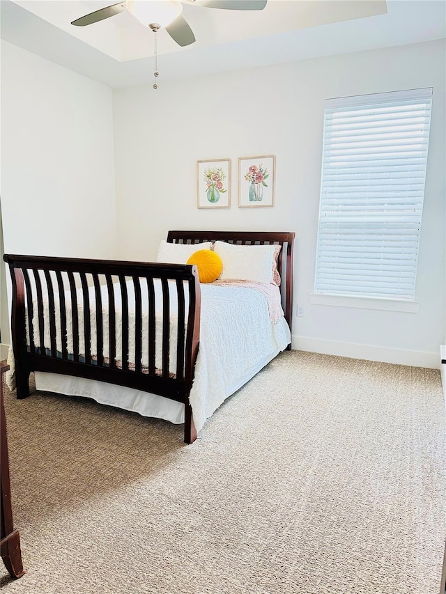 carpeted bedroom with ceiling fan