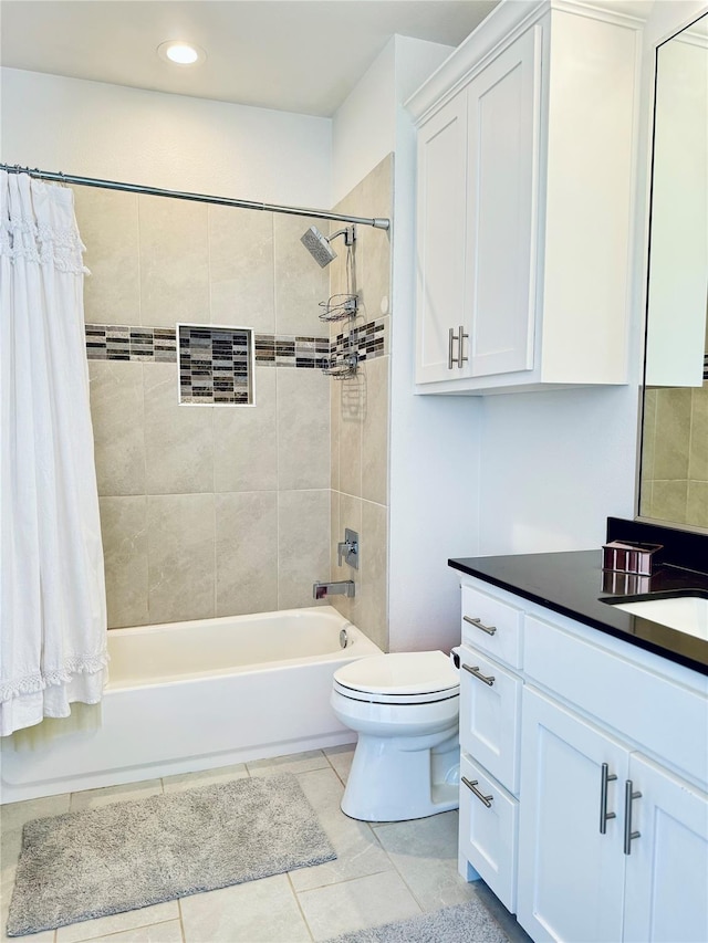 full bathroom with tile patterned floors, vanity, toilet, and shower / bath combination with curtain