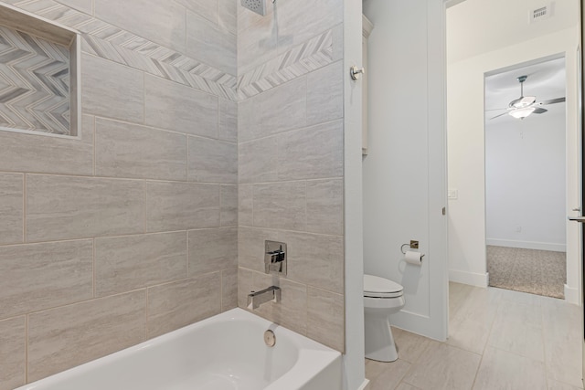 full bathroom with visible vents, baseboards, ceiling fan, toilet, and shower / tub combination