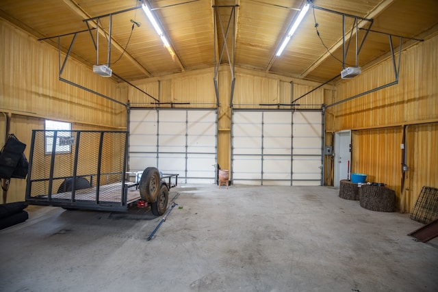 garage featuring metal wall and a garage door opener