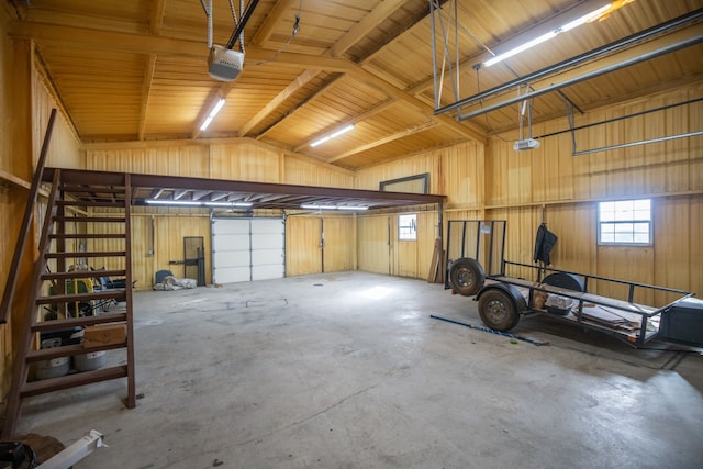 garage with a garage door opener and metal wall