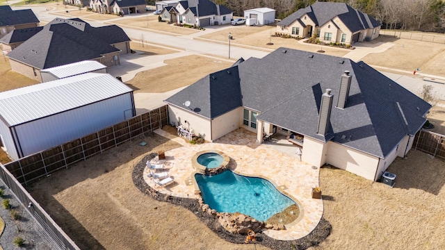 birds eye view of property with a residential view