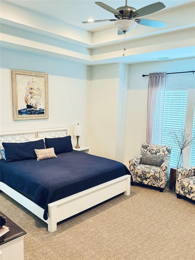 bedroom with ceiling fan and carpet floors