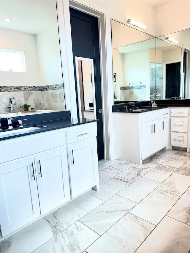 bathroom with tile walls and vanity