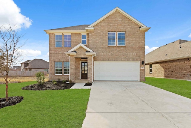 view of front of home featuring a garage and a lawn