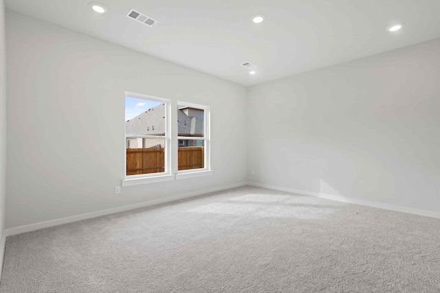 unfurnished room with carpet flooring