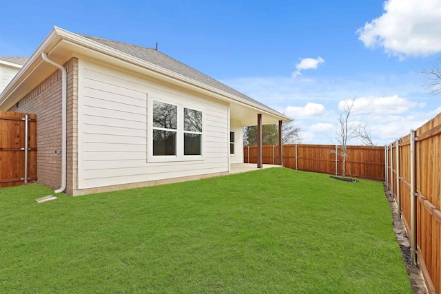 rear view of house featuring a lawn