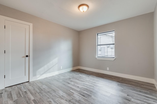 spare room featuring light wood-type flooring