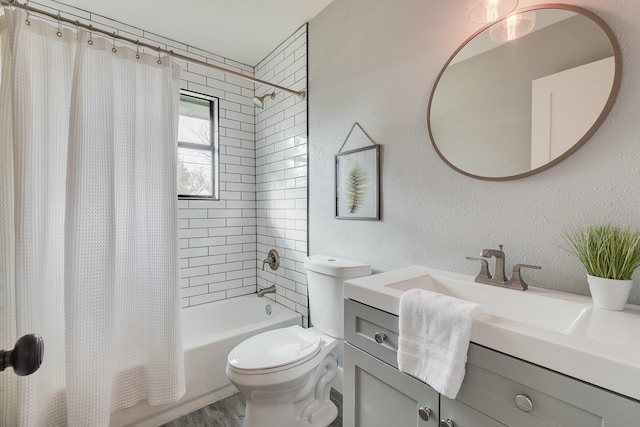 full bathroom featuring toilet, vanity, and shower / bath combination with curtain