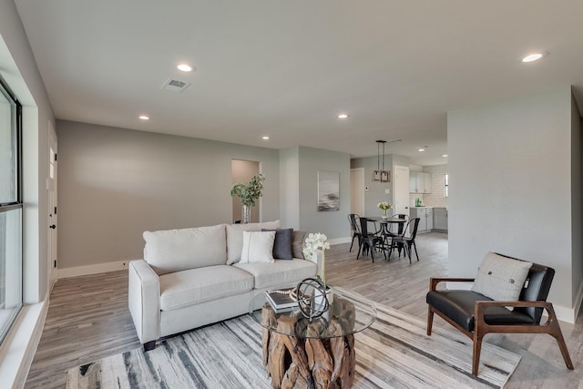 living room with light hardwood / wood-style floors