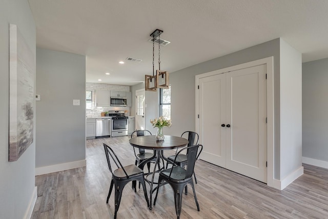 dining area featuring light hardwood / wood-style flooring