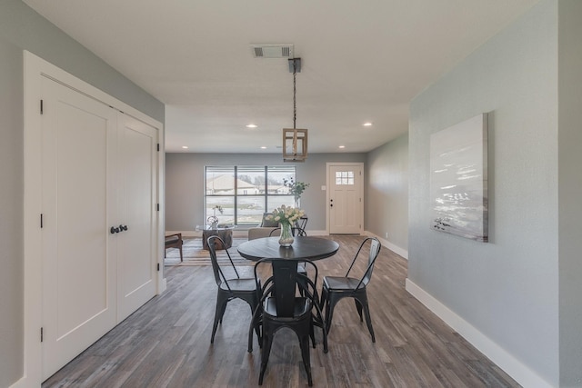 dining room featuring dark wood-type flooring