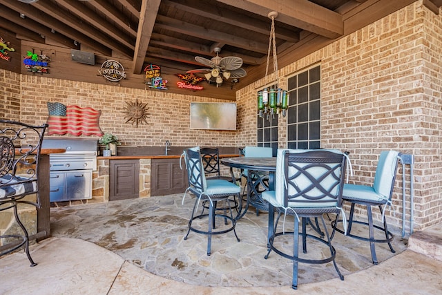 view of patio / terrace with area for grilling and ceiling fan