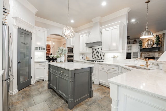 kitchen with premium range hood, decorative light fixtures, gray cabinetry, white cabinets, and stainless steel appliances