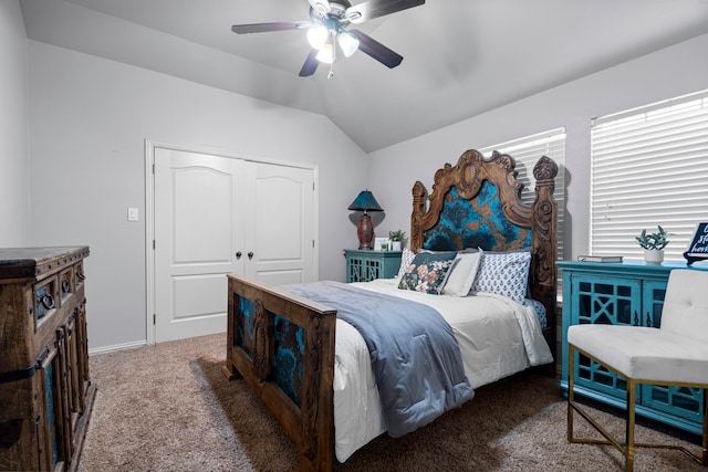 bedroom featuring lofted ceiling, carpet, ceiling fan, and a closet