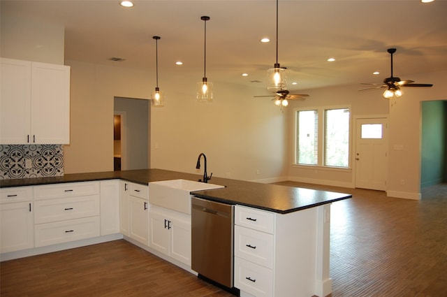 kitchen with white cabinets, dishwasher, tasteful backsplash, sink, and ceiling fan