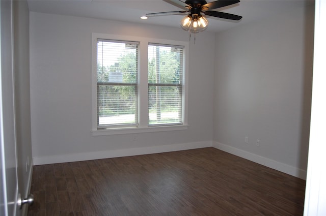 unfurnished room featuring ceiling fan and dark hardwood / wood-style flooring