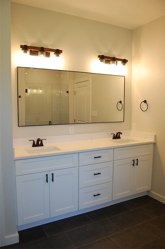 bathroom featuring vanity and tile patterned flooring